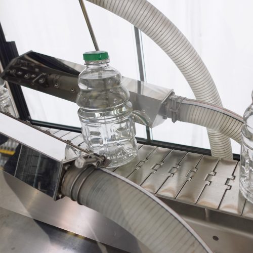 Bottle Blower with Bottle on Conveyor